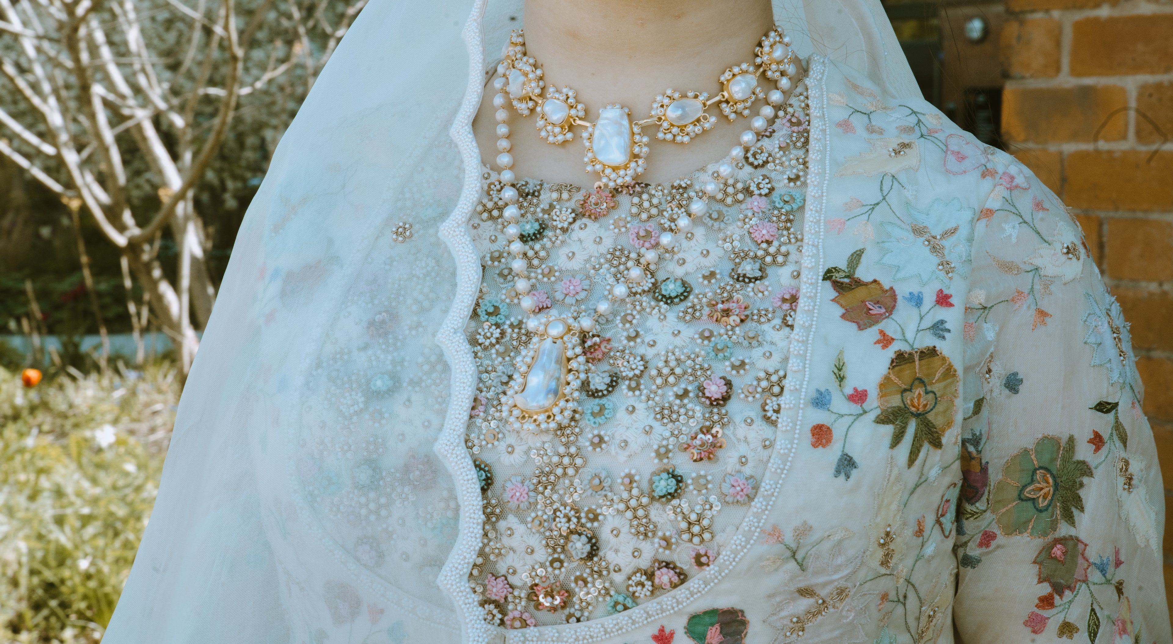 Stunning bride wearing two roya jewellery mother of pearl sets layered together, Item Q and Item T